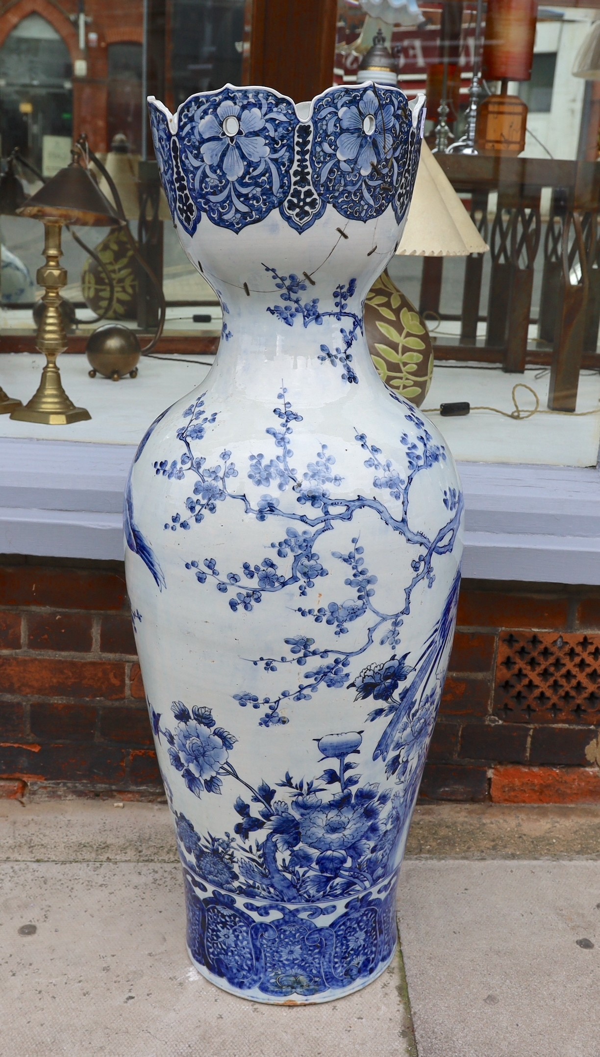 A large Chinese blue and white vase with lobed pierced rim, decorated with exotic birds on prunus branches, height 108cm (a.f)